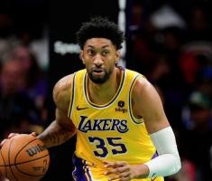 底薪回来吗网友路遇伍德！后者回应：“一日紫金 终身湖人”